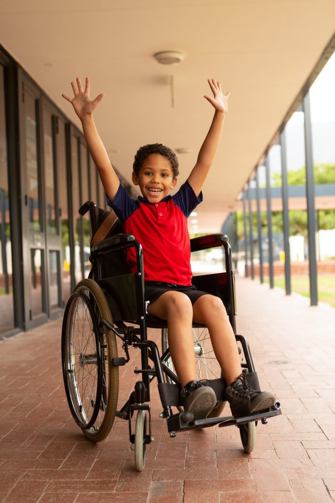 happy disabled school boy